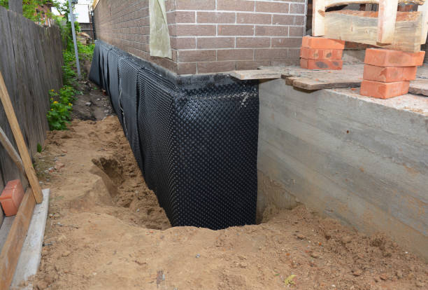 SJ Waterproofing Pros technician performing targeted Sump Pump Installation assessment in Wolcott, NY